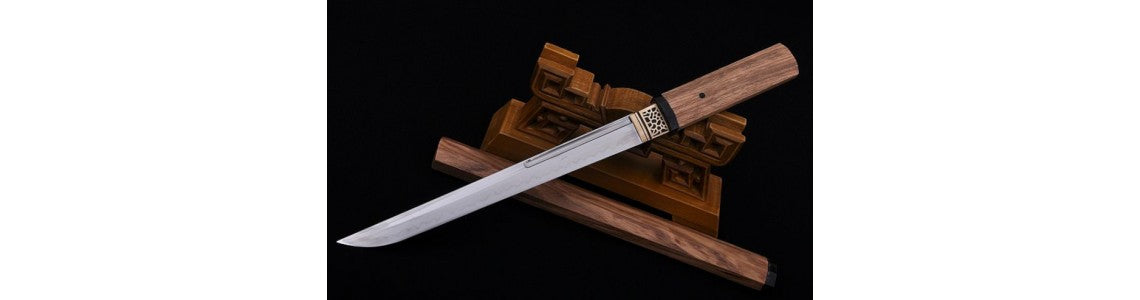 a samurai knife with a wooden handle