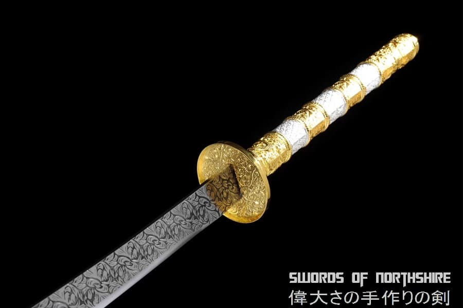 a Chinese sword with a white and gold tsuka