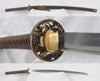 a custom katana with a brown saya